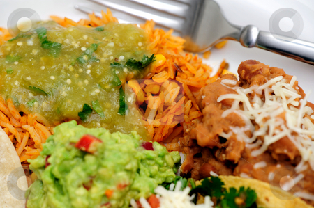 To use this stock image in your creative project, please select the size you need over to the right and click the "Add to Cart" button.
Your downloaded image will come with the Cutcaster watermark removed so don’t worry about the watermark you see on this page. Rice And Refried Beans stock photo, Mexican style meal of Pork Carnitas soft tacos with refried beans, Spanish rice topped with fresh salsa verde and spicy guacamole. by Lynn Bendickson