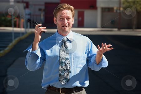 To use this stock image in your creative project, please select the size you need over to the right and click the "Add to Cart" button.
Your downloaded image will come with the Cutcaster watermark removed so don’t worry about the watermark you see on this page. Good-looking guy frustrated with cell phone. stock photo, Exasperated business man with cell phone outdoors by Scott Griessel