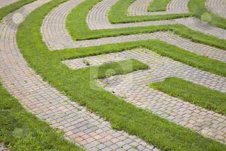 To use this stock image in your creative project, please select the size you need over to the right and click the "Add to Cart" button.
Your downloaded image will come with the Cutcaster watermark removed so don’t worry about the watermark you see on this page. Grass and Cobblestone Maze stock photo, Park maze with a cobblestone walkway and grass boundaries. Horizontal shot. by Edward Bock