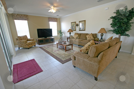 To use this stock image in your creative project, please select the size you need over to the right and click the "Add to Cart" button.
Your downloaded image will come with the Cutcaster watermark removed so don’t worry about the watermark you see on this page. Living Room stock photo, An Interior Living Room in a Home by Lucy Clark