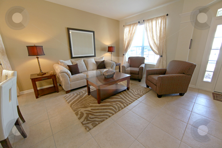 To use this stock image in your creative project, please select the size you need over to the right and click the "Add to Cart" button.
Your downloaded image will come with the Cutcaster watermark removed so don’t worry about the watermark you see on this page. Living Room stock photo, An Interior Living Room of a Home by Lucy Clark
