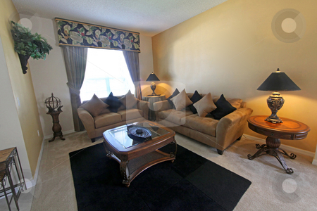 To use this stock image in your creative project, please select the size you need over to the right and click the "Add to Cart" button.
Your downloaded image will come with the Cutcaster watermark removed so don’t worry about the watermark you see on this page. Living Room stock photo, An Interior Living Room in a Home by Lucy Clark