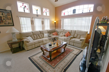 To use this stock image in your creative project, please select the size you need over to the right and click the "Add to Cart" button.
Your downloaded image will come with the Cutcaster watermark removed so don’t worry about the watermark you see on this page. Living Room stock photo, An Interior Living Room of a Home by Lucy Clark