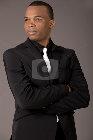 To use this stock image in your creative project, please select the size you need over to the right and click the "Add to Cart" button.
Your downloaded image will come with the Cutcaster watermark removed so don’t worry about the watermark you see on this page. Young black american business man with folded hands stock photo, Young black american business man with folded hands on a grey background by Get4net