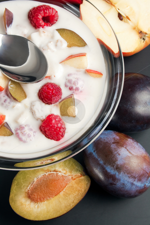 To use this stock image in your creative project, please select the size you need over to the right and click the "Add to Cart" button.
Your downloaded image will come with the Cutcaster watermark removed so don’t worry about the watermark you see on this page. Yogurt mixed with fruit pieces stock photo, Glass bowl filled with yogurt mixed with fruit pieces arranged with spoon and some fruits around by Miroslav Ivanov