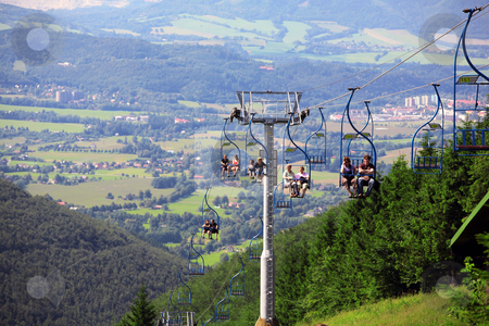 To use this stock image in your creative project, please select the size you need over to the right and click the "Add to Cart" button.
Your downloaded image will come with the Cutcaster watermark removed so don’t worry about the watermark you see on this page. Village Pustevny, Czech republic stock photo, Cable railway over hill on Beskydy, Czech Republic by Tomas Hajek