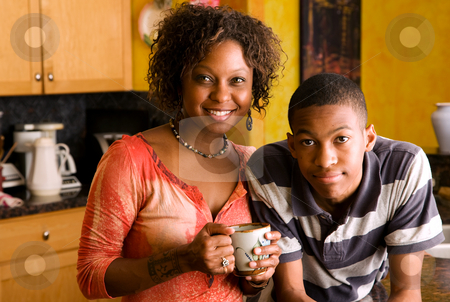 To use this stock image in your creative project, please select the size you need over to the right and click the "Add to Cart" button.
Your downloaded image will come with the Cutcaster watermark removed so don’t worry about the watermark you see on this page. African-American family members in kitchen stock photo, Attractive African-American family members posed in kitchen by Scott Griessel