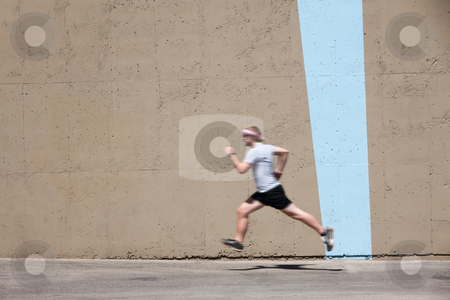 To use this stock image in your creative project, please select the size you need over to the right and click the "Add to Cart" button.
Your downloaded image will come with the Cutcaster watermark removed so don’t worry about the watermark you see on this page. Man runs to prepare for race stock photo, Man runs for fun and exercise by Scott Griessel