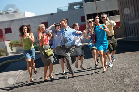 To use this stock image in your creative project, please select the size you need over to the right and click the "Add to Cart" button.
Your downloaded image will come with the Cutcaster watermark removed so don’t worry about the watermark you see on this page. Young business workers run down steet. stock photo, Group of hard working business men and women run down city street. by Scott Griessel