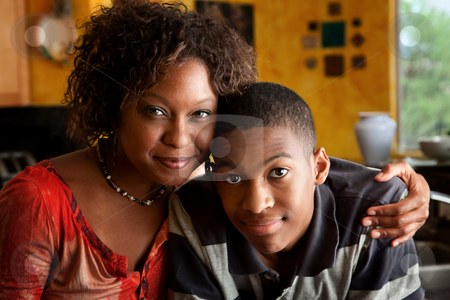 To use this stock image in your creative project, please select the size you need over to the right and click the "Add to Cart" button.
Your downloaded image will come with the Cutcaster watermark removed so don’t worry about the watermark you see on this page. African-American woman with young man in kitchen stock photo, Attractive African-American woman with young man in kitchen by Scott Griessel