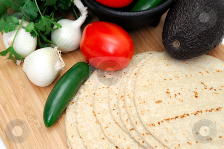 To use this stock image in your creative project, please select the size you need over to the right and click the "Add to Cart" button.
Your downloaded image will come with the Cutcaster watermark removed so don’t worry about the watermark you see on this page. Spicy Food Concept stock photo, Assorted ingredients for the start of a spicy meal including fresh tortillas, Serrano chili, tomato, cilantro and avocado by Lynn Bendickson