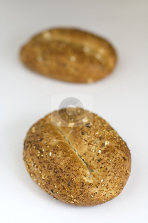 To use this stock image in your creative project, please select the size you need over to the right and click the "Add to Cart" button.
Your downloaded image will come with the Cutcaster watermark removed so don’t worry about the watermark you see on this page. Cereal buns stock photo, Two small baked cereal bun on white photo, shallow depth of view by Robert Remen