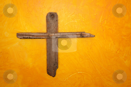 To use this stock image in your creative project, please select the size you need over to the right and click the "Add to Cart" button.
Your downloaded image will come with the Cutcaster watermark removed so don’t worry about the watermark you see on this page. Wooden Cross stock photo, Rugged wooden cross hanging on yellow wall by Scott Griessel