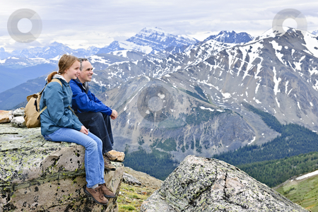 To use this stock image in your creative project, please select the size you need over to the right and click the "Add to Cart" button.
Your downloaded image will come with the Cutcaster watermark removed so don’t worry about the watermark you see on this page. Father and daughter in mountains stock photo, Father and daughter enjoying scenic Canadian Rocky Mountains view in Jasper National park by Elena Elisseeva