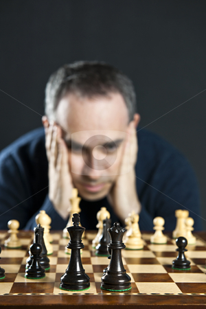 To use this stock image in your creative project, please select the size you need over to the right and click the "Add to Cart" button.
Your downloaded image will come with the Cutcaster watermark removed so don’t worry about the watermark you see on this page. Man at chess board stock photo, Chessboard with man thinking about chess strategy by Elena Elisseeva