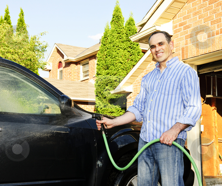 To use this stock image in your creative project, please select the size you need over to the right and click the "Add to Cart" button.
Your downloaded image will come with the Cutcaster watermark removed so don’t worry about the watermark you see on this page. Man washing car on driveway stock photo, Man washing his car on the driveway by Elena Elisseeva