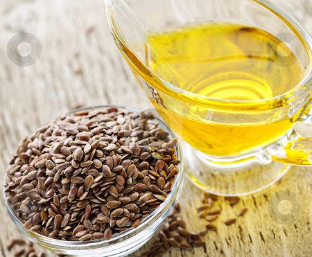 To use this stock image in your creative project, please select the size you need over to the right and click the "Add to Cart" button.
Your downloaded image will come with the Cutcaster watermark removed so don’t worry about the watermark you see on this page. Brown flax seed and linseed oil stock photo, Bowl of brown flax seed and linseed oil by Elena Elisseeva