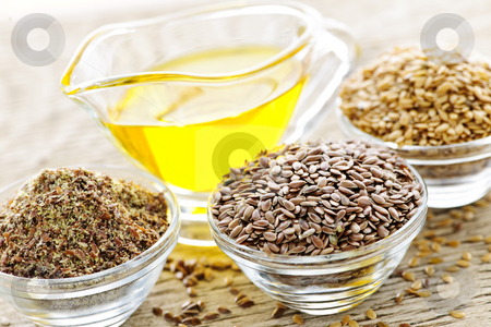 To use this stock image in your creative project, please select the size you need over to the right and click the "Add to Cart" button.
Your downloaded image will come with the Cutcaster watermark removed so don’t worry about the watermark you see on this page. Flax seeds and linseed oil stock photo, Bowls of whole and ground flax seed with linseed oil by Elena Elisseeva