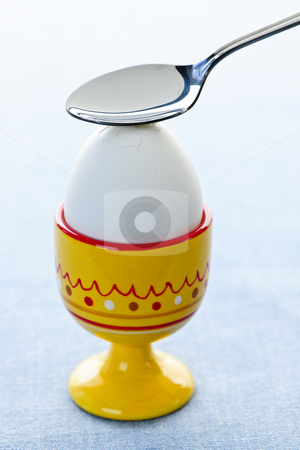To use this stock image in your creative project, please select the size you need over to the right and click the "Add to Cart" button.
Your downloaded image will come with the Cutcaster watermark removed so don’t worry about the watermark you see on this page. Boiled egg in cup stock photo, Breaking open a soft boiled egg in cup with spoon by Elena Elisseeva