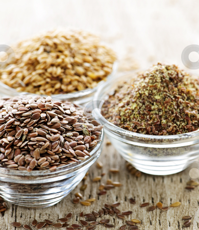 To use this stock image in your creative project, please select the size you need over to the right and click the "Add to Cart" button.
Your downloaded image will come with the Cutcaster watermark removed so don’t worry about the watermark you see on this page. Brown and golden flax seed stock photo, Bowls of whole and ground flax seed or linseed by Elena Elisseeva