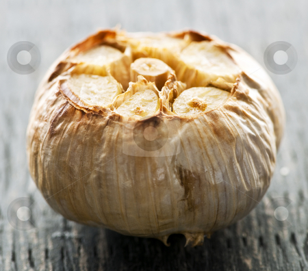 To use this stock image in your creative project, please select the size you need over to the right and click the "Add to Cart" button.
Your downloaded image will come with the Cutcaster watermark removed so don’t worry about the watermark you see on this page. Roasted garlic bulb stock photo, Close up of fresh roasted garlic bulb by Elena Elisseeva