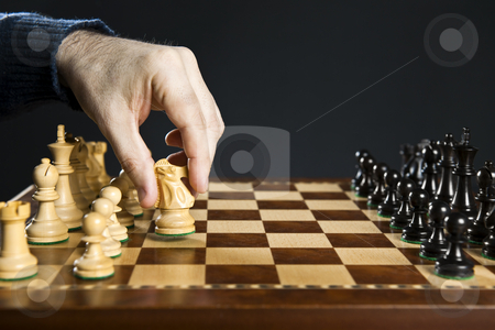 To use this stock image in your creative project, please select the size you need over to the right and click the "Add to Cart" button.
Your downloaded image will come with the Cutcaster watermark removed so don’t worry about the watermark you see on this page. Hand moving knight on chess board stock photo, Hand moving a knight chess piece on wooden chessboard by Elena Elisseeva