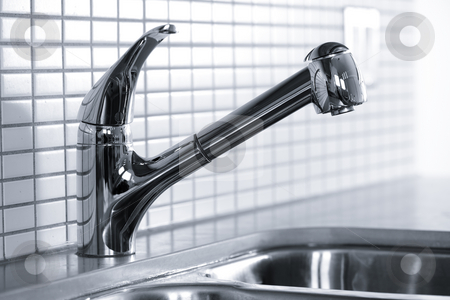 To use this stock image in your creative project, please select the size you need over to the right and click the "Add to Cart" button.
Your downloaded image will come with the Cutcaster watermark removed so don’t worry about the watermark you see on this page. Kitchen faucet stock photo, Stainless steel kitchen faucet and sink with tile backsplash by Elena Elisseeva