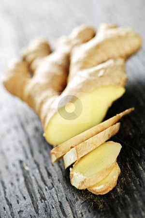 To use this stock image in your creative project, please select the size you need over to the right and click the "Add to Cart" button.
Your downloaded image will come with the Cutcaster watermark removed so don’t worry about the watermark you see on this page. Ginger root stock photo, Close up of sliced fresh ginger root spice on wooden table by Elena Elisseeva