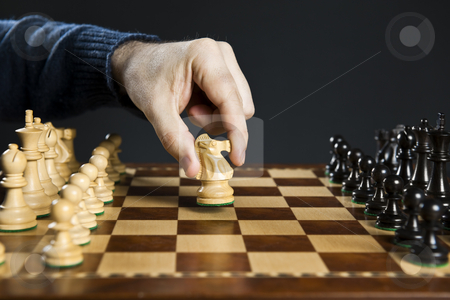 To use this stock image in your creative project, please select the size you need over to the right and click the "Add to Cart" button.
Your downloaded image will come with the Cutcaster watermark removed so don’t worry about the watermark you see on this page. Hand moving knight on chess board stock photo, Hand moving a knight chess piece on wooden chessboard by Elena Elisseeva