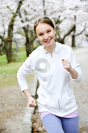 To use this stock image in your creative project, please select the size you need over to the right and click the "Add to Cart" button.
Your downloaded image will come with the Cutcaster watermark removed so don’t worry about the watermark you see on this page. Girl jogging in park stock photo, Beautiful teenage girl jogging in park with blooming apple trees by Elena Elisseeva