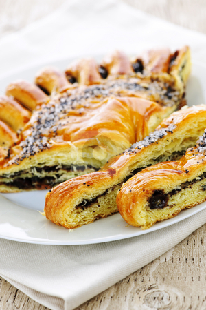 To use this stock image in your creative project, please select the size you need over to the right and click the "Add to Cart" button.
Your downloaded image will come with the Cutcaster watermark removed so don’t worry about the watermark you see on this page. Poppy seed strudel stock photo, Closeup of poppy seed strudel dessert pastry with slices by Elena Elisseeva
