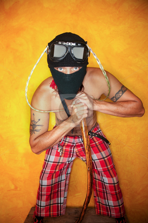 To use this stock image in your creative project, please select the size you need over to the right and click the "Add to Cart" button.
Your downloaded image will come with the Cutcaster watermark removed so don’t worry about the watermark you see on this page. Strange Man stock photo, Strange man with knit mask and plaid pants by Scott Griessel