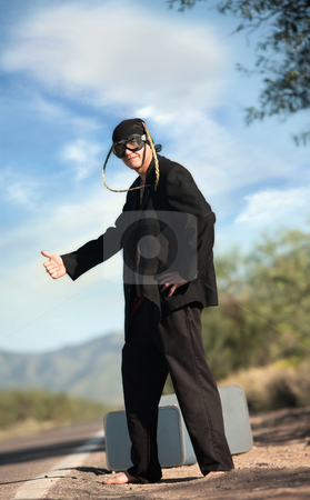 To use this stock image in your creative project, please select the size you need over to the right and click the "Add to Cart" button.
Your downloaded image will come with the Cutcaster watermark removed so don’t worry about the watermark you see on this page. Strange indigenous man by the side of the road stock photo, Strange indigenous man by the side of desert road by Scott Griessel