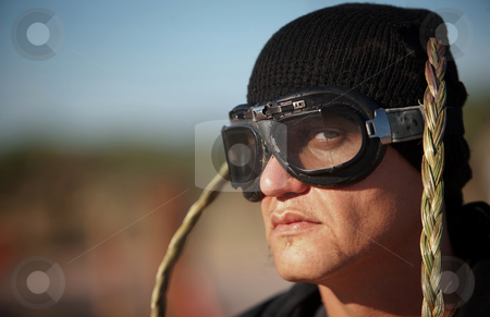 To use this stock image in your creative project, please select the size you need over to the right and click the "Add to Cart" button.
Your downloaded image will come with the Cutcaster watermark removed so don’t worry about the watermark you see on this page. Man with knit cap and goggles stock photo, Man with knit cap, goggles and headdress by Scott Griessel