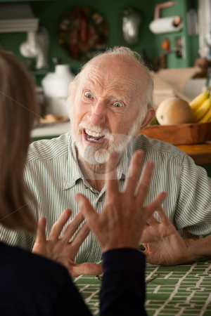 To use this stock image in your creative project, please select the size you need over to the right and click the "Add to Cart" button.
Your downloaded image will come with the Cutcaster watermark removed so don’t worry about the watermark you see on this page. Senior couple at home focusing on angry man stock photo, Senior couple at home in kitchen focusing on angry man by Scott Griessel