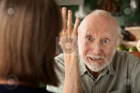 To use this stock image in your creative project, please select the size you need over to the right and click the "Add to Cart" button.
Your downloaded image will come with the Cutcaster watermark removed so don’t worry about the watermark you see on this page. Senior couple at home focusing on angry man stock photo, Senior couple at home in kitchen focusing on angry man by Scott Griessel