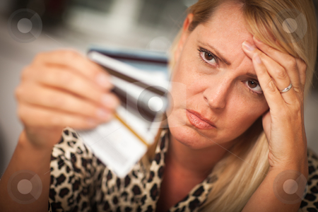 To use this stock image in your creative project, please select the size you need over to the right and click the "Add to Cart" button.
Your downloaded image will come with the Cutcaster watermark removed so don’t worry about the watermark you see on this page. Upset Woman Glaring At Her Many Credit Cards stock photo, Upset Robed Woman Glaring At Her Many Credit Cards. by Andy Dean