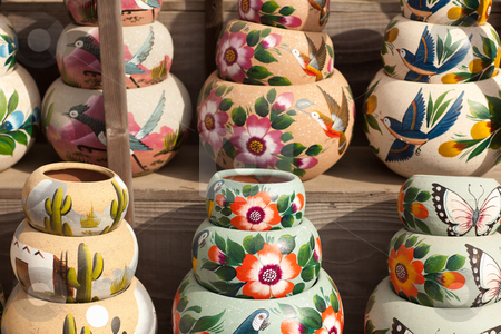 To use this stock image in your creative project, please select the size you need over to the right and click the "Add to Cart" button.
Your downloaded image will come with the Cutcaster watermark removed so don’t worry about the watermark you see on this page. Variety of Colorfully Painted Ceramic Pots stock photo, Variety of Colorfully Painted Ceramic Pots in an Outdoor Shopping Market. by Andy Dean