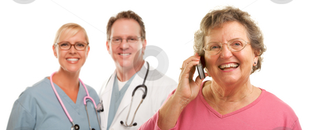 To use this stock image in your creative project, please select the size you need over to the right and click the "Add to Cart" button.
Your downloaded image will come with the Cutcaster watermark removed so don’t worry about the watermark you see on this page. Happy Senior Woman Using Cell Phone and Doctors Behind stock photo, Happy Senior Woman Using Cell Phone with Male and Female Doctors or Nurses Behind Isolated on a White Background. by Andy Dean