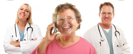 To use this stock image in your creative project, please select the size you need over to the right and click the "Add to Cart" button.
Your downloaded image will come with the Cutcaster watermark removed so don’t worry about the watermark you see on this page. Happy Senior Woman Using Cell Phone and Doctors Behind stock photo, Happy Senior Woman Using Cell Phone with Male and Female Doctors or Nurses Behind Isolated on a White Background. by Andy Dean