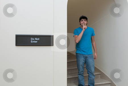 To use this stock image in your creative project, please select the size you need over to the right and click the "Add to Cart" button.
Your downloaded image will come with the Cutcaster watermark removed so don’t worry about the watermark you see on this page. Sneaking Teen stock photo, A teenage boy is sneaking into an area that he isn't supposed to go to. by Richard Nelson