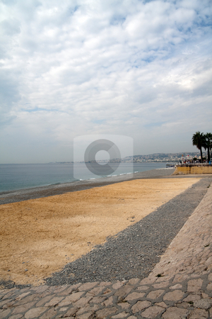 To use this stock image in your creative project, please select the size you need over to the right and click the "Add to Cart" button.
Your downloaded image will come with the Cutcaster watermark removed so don’t worry about the watermark you see on this page. Sandy Beach stock photo, The sandy and rocky beach in Nice, France by Kevin Tietz