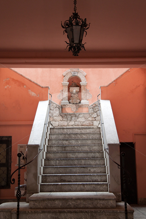 To use this stock image in your creative project, please select the size you need over to the right and click the "Add to Cart" button.
Your downloaded image will come with the Cutcaster watermark removed so don’t worry about the watermark you see on this page. Staircase stock photo, A grand colorful staircase leading up a hill by Kevin Tietz