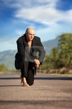 To use this stock image in your creative project, please select the size you need over to the right and click the "Add to Cart" button.
Your downloaded image will come with the Cutcaster watermark removed so don’t worry about the watermark you see on this page. Indigenous man in the middle of a road stock photo, Strange indigenous man in the middle of a road by Scott Griessel
