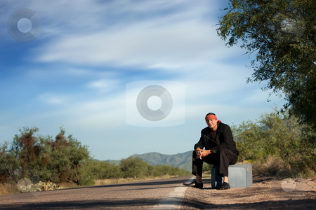 To use this stock image in your creative project, please select the size you need over to the right and click the "Add to Cart" button.
Your downloaded image will come with the Cutcaster watermark removed so don’t worry about the watermark you see on this page. Indigenous man by the side of the road stock photo, Handsome indigenous man by the side of the road with copy space by Scott Griessel
