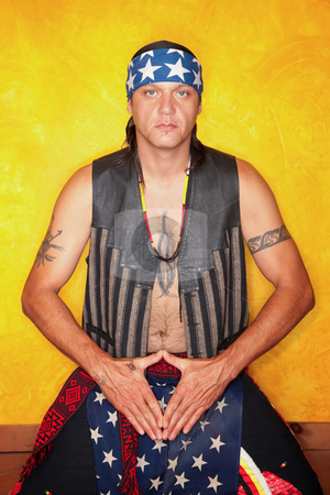 To use this stock image in your creative project, please select the size you need over to the right and click the "Add to Cart" button.
Your downloaded image will come with the Cutcaster watermark removed so don’t worry about the watermark you see on this page. Kneeling Native American man stock photo, Kneeling Native American man with tattoos and vest by Scott Griessel