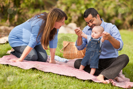 To use this stock image in your creative project, please select the size you need over to the right and click the "Add to Cart" button.
Your downloaded image will come with the Cutcaster watermark removed so don’t worry about the watermark you see on this page. Happy Mixed Race Family Playing In The Park stock photo, Happy Mixed Race Family Having a Picnic and Playing In The Park. by Andy Dean