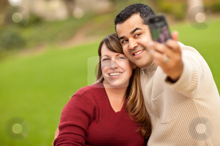 To use this stock image in your creative project, please select the size you need over to the right and click the "Add to Cart" button.
Your downloaded image will come with the Cutcaster watermark removed so don’t worry about the watermark you see on this page. Attractive Mixed Race Couple Taking Self Portraits stock photo, Attractive Mixed Race Couple Taking Self Portraits in the Park. by Andy Dean