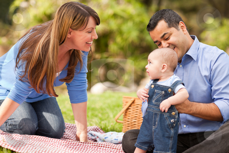 To use this stock image in your creative project, please select the size you need over to the right and click the "Add to Cart" button.
Your downloaded image will come with the Cutcaster watermark removed so don’t worry about the watermark you see on this page. Happy Mixed Race Family Playing In The Park stock photo, Happy Mixed Race Family Having a Picnic and Playing In The Park. by Andy Dean