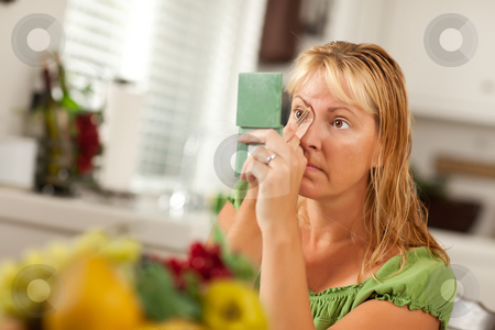 To use this stock image in your creative project, please select the size you need over to the right and click the "Add to Cart" button.
Your downloaded image will come with the Cutcaster watermark removed so don’t worry about the watermark you see on this page. Blonde Woman Applying Her Makeup stock photo, Blonde Woman Applying Her Makeup in Her Bathroom. by Andy Dean